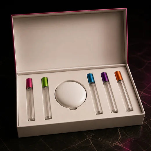 An open presentation box holding five ampoules and a compact