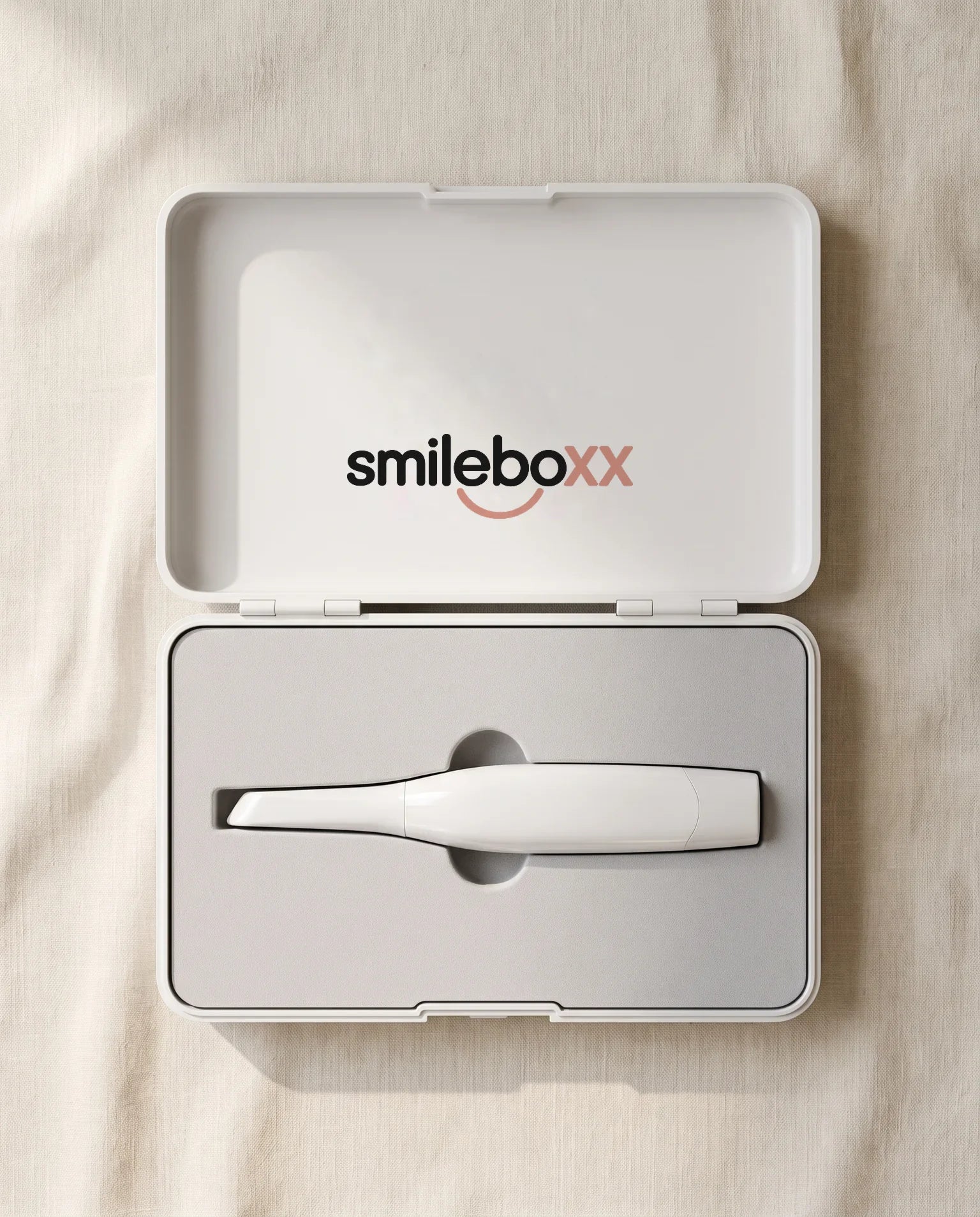 An open white carry case printed smileboxx holding a white handheld scanner